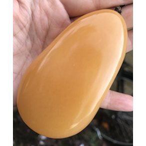 Gul honing calcit hndstykke. Ca. 200gram. 9cm